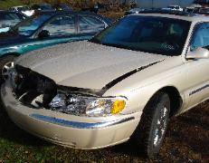 2002 Lincoln Continental collision damage before repair at Reliable Auto Body